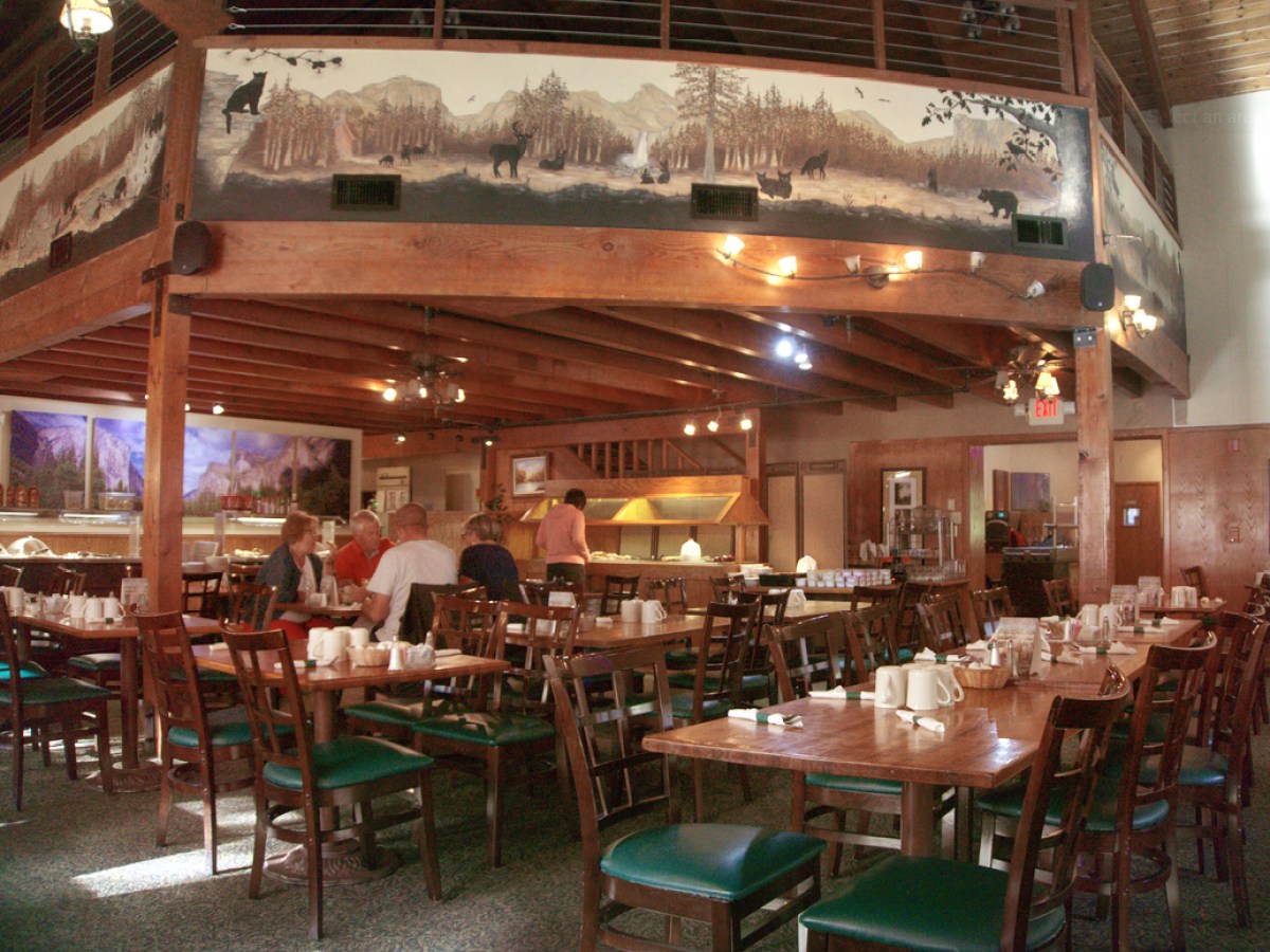 a group of people sitting at a table in a restaurant