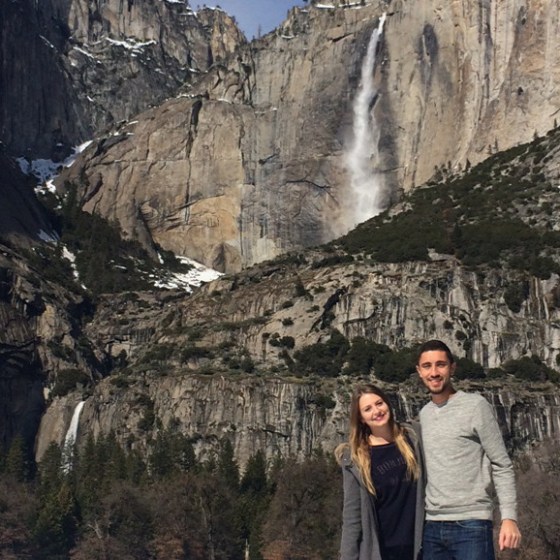 a man standing in front of a canyon
