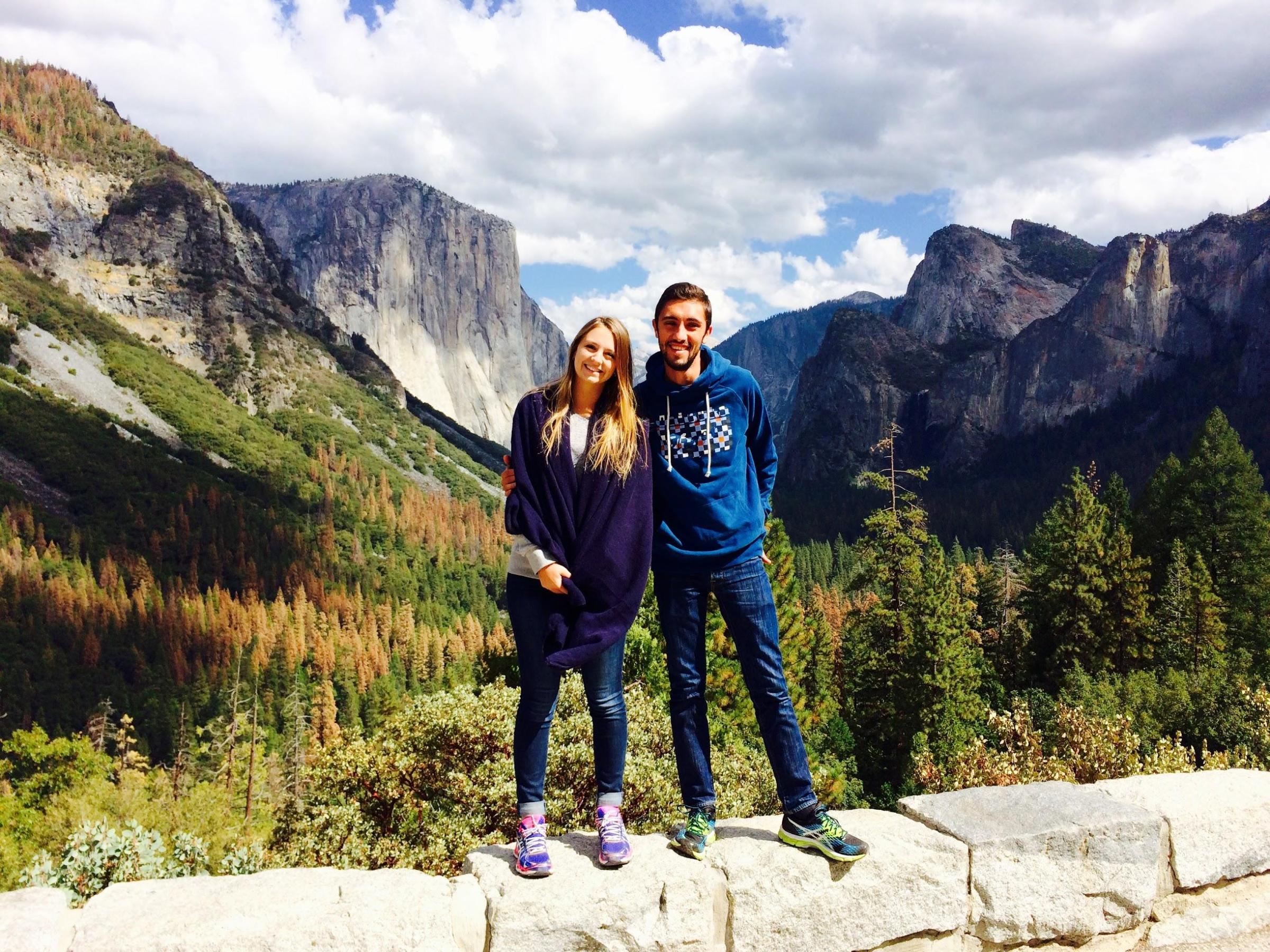 a man standing in front of a mountain