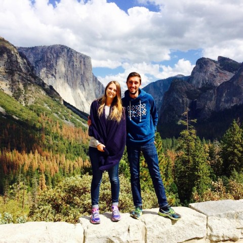 a man standing in front of a mountain