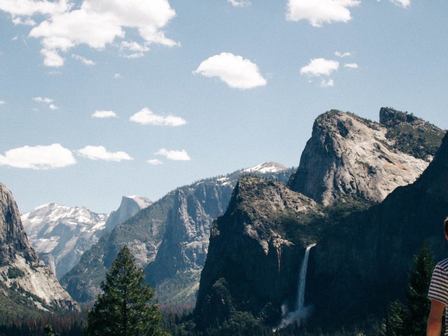 a man standing in front of a canyon
