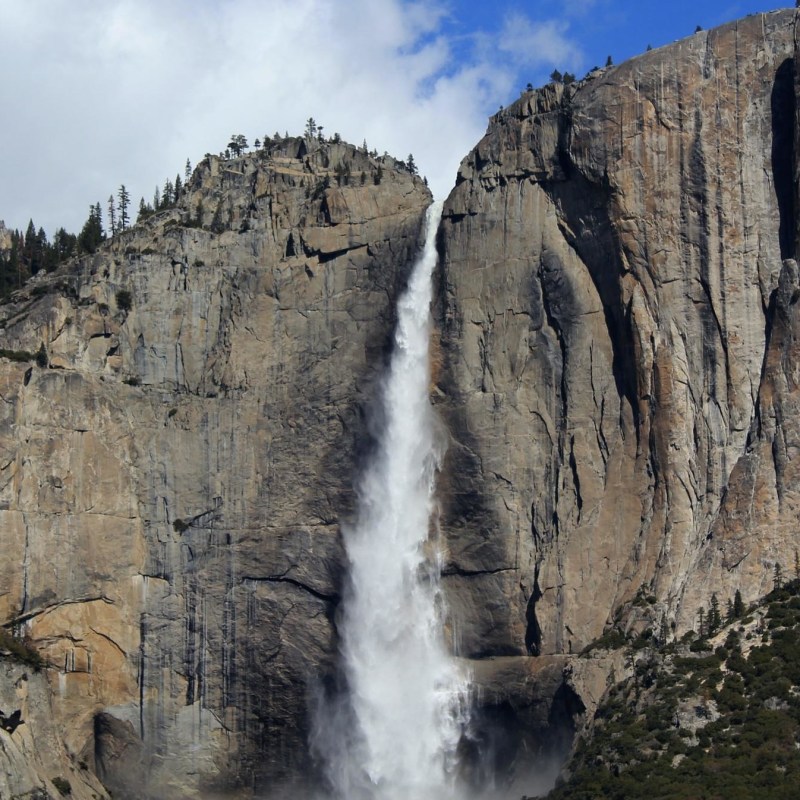 Yosemite 4 Day Tour – Tent Cabin Stay Image 4 a stone building that has a rocky cliff