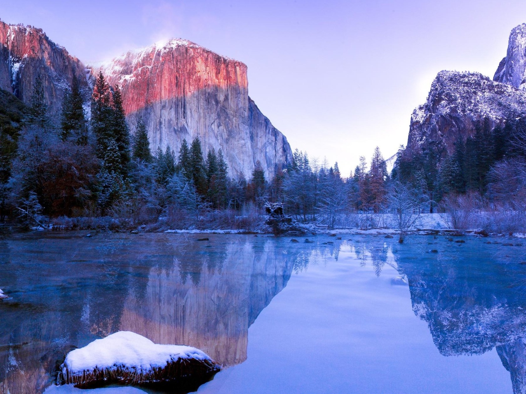 a lake with a mountain in the background