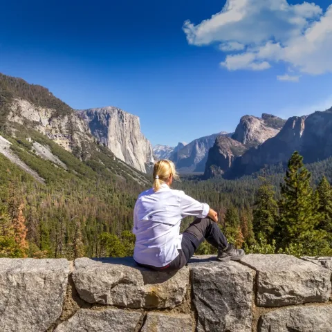 a man sitting on a rock