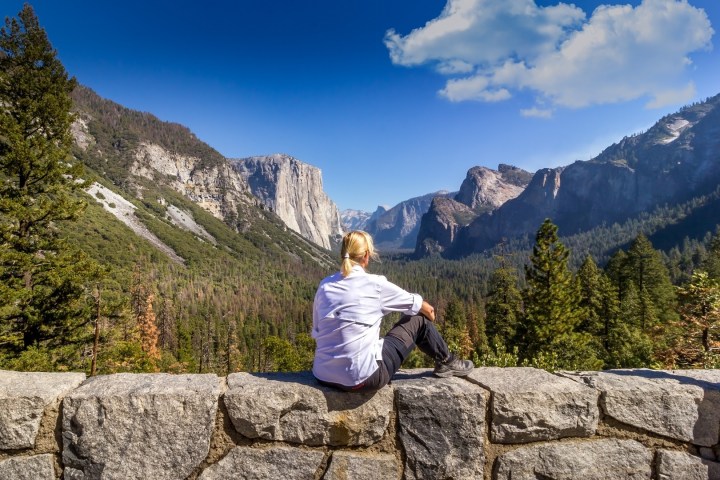 a man sitting on a rock